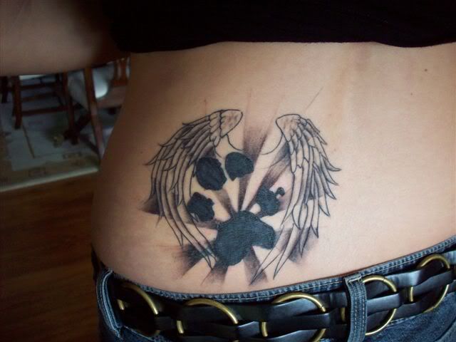 dog paw print tattoo. peggy's tattoo. Here's a pic of the half done tattoo.