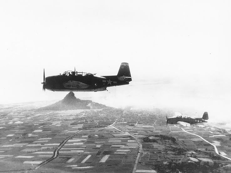 [Image: TBMs_VC-84_CVE-93_IeShima_Apr1945.jpg]