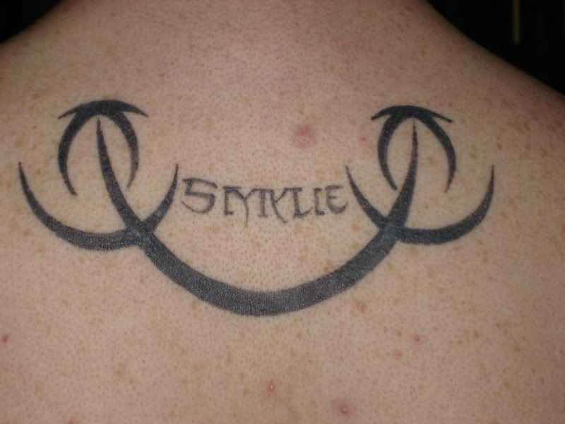 http://i20.photobucket.com/albums/b217/yomomsacunt/Tattoos005.jpg