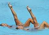 Russia's world champions Anastasia Davydova and Anastasia Ermikova perform their duet technical routine at the Athens 2004 Olympic Games August 23, 2004. [Reuters]