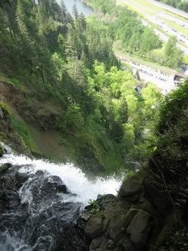 at the top of the falls, can you see the bridge and the path way down below and then the cars