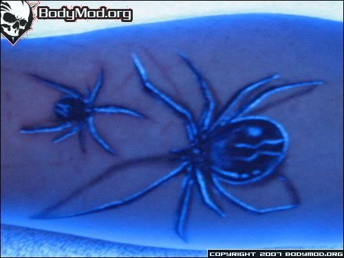 A tattoo that is made from UV (ultra-violet) reactive ink or 